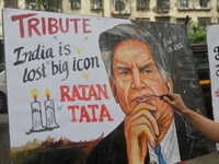 A teacher at Gurukul Art School paints a mural of Ratan Tata as a tribute in Mumbai, India, on October 10, 2024. Ratan Tata is the businessm...