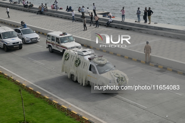 A hearse vehicle is seen with the mortal remains of Indian industrialist Ratan Tata ahead of the cremation in Mumbai, India, on October 10,...