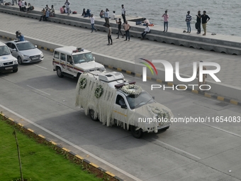 A hearse vehicle is seen with the mortal remains of Indian industrialist Ratan Tata ahead of the cremation in Mumbai, India, on October 10,...