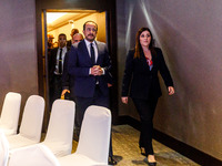 President of Cyprus Nikos Christodoulides and Deputy Minister of Shipping Marina Hadjimanolis enter the room in Limassol, Cyprus, on October...