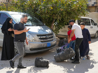 Syrian refugees return to their homeland through the Aoun Al-Dadat crossing in northern Manbij after traveling from Lebanon to opposition-he...