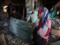 Palestinians inspect a school that the Israeli occupation army attacks in Deir al-Balah, Gaza, on October 10, 2024. The Israeli army attacks...