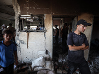 Palestinians inspect a school that the Israeli occupation army attacks in Deir al-Balah, Gaza, on October 10, 2024. The Israeli army attacks...