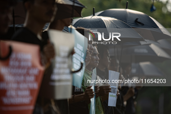 Human rights activists participate in the 835th Aksi Kamisan, or Thursday's Protest, in front of the Presidential Palace in Jakarta, Indones...