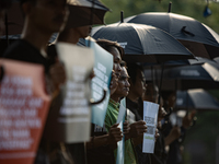 Human rights activists participate in the 835th Aksi Kamisan, or Thursday's Protest, in front of the Presidential Palace in Jakarta, Indones...