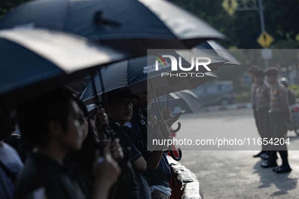 Human rights activists participate in the 835th Aksi Kamisan, or Thursday's Protest, in front of the Presidential Palace in Jakarta, Indones...