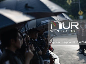 Human rights activists participate in the 835th Aksi Kamisan, or Thursday's Protest, in front of the Presidential Palace in Jakarta, Indones...