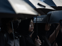 Human rights activists participate in the 835th Aksi Kamisan, or Thursday's Protest, in front of the Presidential Palace in Jakarta, Indones...