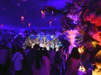 Devotees throng at a community 'puja pandal' themed on 'under the sea' during the Durga Puja festival in the Nagaon district of Assam, India...