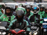 Motorcycle taxis are caught in traffic congestion in the business district of Jakarta, Indonesia, on October 10, 2024. According to the Expe...