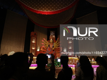 People visit a ''pandal'' or temporary platform during the Durga Puja festival in Kolkata, India, on October 10, 2024. The annual Durga Puja...