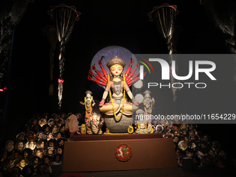 A Hindu goddess Durga is pictured inside a ''pandal'' or temporary platform during the Durga Puja festival in Kolkata, India, on October 10,...