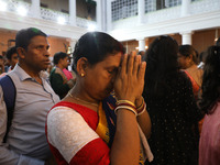 A woman offers prayer at a heritage house during the Durga Puja festival in Kolkata, India, on October 10, 2024. The annual Durga Puja festi...