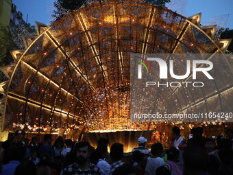 People visit a ''pandal'' or temporary platform during the Durga Puja festival in Kolkata, India, on October 10, 2024. The annual Durga Puja...