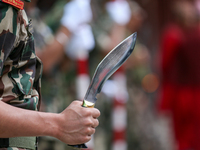 A Nepal Army personnel stands guard ahead of the formal beginning of the Phulpati procession in Kathmandu, Nepal, on October 10, 2024. (