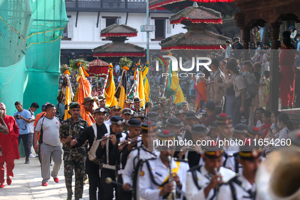 The Nepal Army band parades through the Kathmandu Durbar Square as they start the Phulpati procession in Kathmandu, Nepal, on October 10, 20...