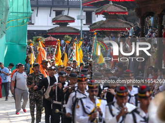 The Nepal Army band parades through the Kathmandu Durbar Square as they start the Phulpati procession in Kathmandu, Nepal, on October 10, 20...