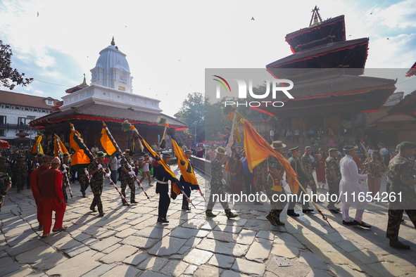 The Nepal Army band parades through the Kathmandu Durbar Square as they start the Phulpati procession in Kathmandu, Nepal, on October 10, 20...