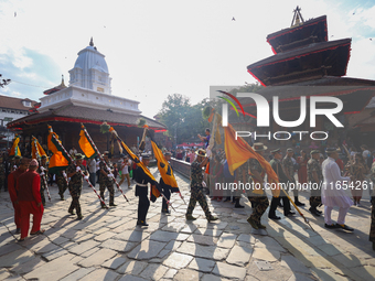 The Nepal Army band parades through the Kathmandu Durbar Square as they start the Phulpati procession in Kathmandu, Nepal, on October 10, 20...