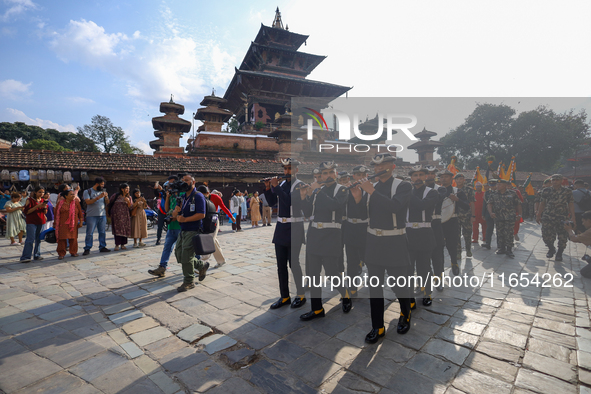 The Nepal Army band parades through the Kathmandu Durbar Square as they start the Phulpati procession in Kathmandu, Nepal, on October 10, 20...