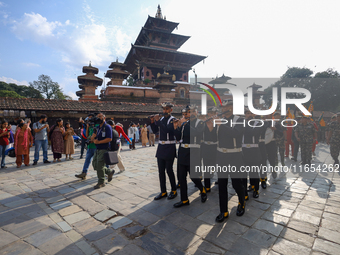 The Nepal Army band parades through the Kathmandu Durbar Square as they start the Phulpati procession in Kathmandu, Nepal, on October 10, 20...