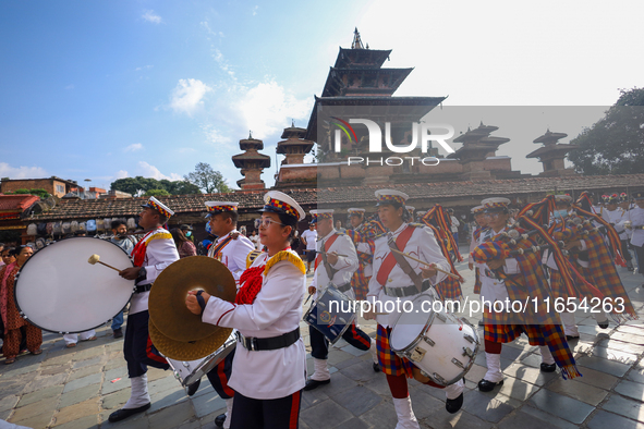 The Nepal Army band parades through the Kathmandu Durbar Square as they start the Phulpati procession in Kathmandu, Nepal, on October 10, 20...