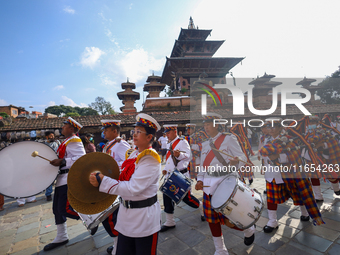 The Nepal Army band parades through the Kathmandu Durbar Square as they start the Phulpati procession in Kathmandu, Nepal, on October 10, 20...