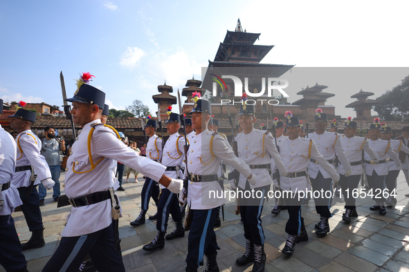 The Nepal Army band parades through the Kathmandu Durbar Square as they start the Phulpati procession in Kathmandu, Nepal, on October 10, 20...