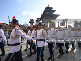 The Nepal Army band parades through the Kathmandu Durbar Square as they start the Phulpati procession in Kathmandu, Nepal, on October 10, 20...