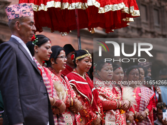 A chorus sings Malashree Dhun during the Phulpati procession in Kathmandu, Nepal, on October 10, 2024. (