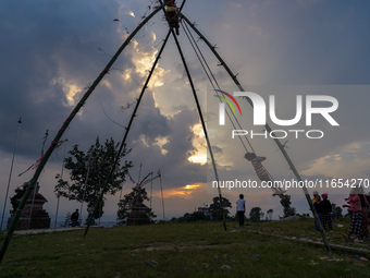 People play on a traditional bamboo swing during the Dashain festival in the outskirts of Kathmandu, Nepal, on October 10, 2024. (