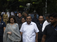 Mukesh Ambani, Chairman and Managing Director of Reliance Industries, and his wife Nita Ambani, an Indian philanthropist and businesswoman,...