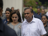 Mukesh Ambani, Chairman and Managing Director of Reliance Industries, and his wife Nita Ambani, an Indian philanthropist and businesswoman,...