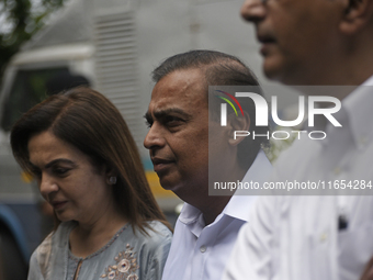 Mukesh Ambani, Chairman and Managing Director of Reliance Industries, and his wife Nita Ambani, an Indian philanthropist and businesswoman,...