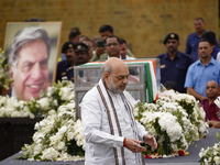 India's Home Minister Amit Shah arrives to pay tribute to the mortal remains of Indian industrialist Ratan Tata at the National Centre for t...