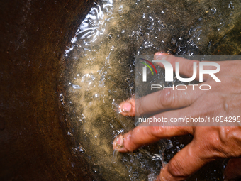 White sediment, typically caused by dissolved minerals like calcium and magnesium associated with water hardness, is visible in water at Teh...