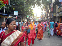 People walk inside a market in Kolkata, India, on October 10, 2024. (