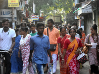 People walk inside a market in Kolkata, India, on October 10, 2024. (