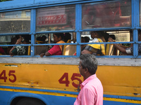 People travel on a private bus in Kolkata, India, on October 10, 2024. (