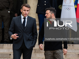 French President Emmanuel Macron and Ukrainian President Volodymyr Zelensky are at the Elysee Palace during the first bilateral summit of Ze...