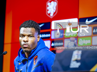 Netherlands defender Denzel Dumfries attends a press conference at the Puskas Arena for the UEFA Nations League season 2024-2025 in Budapest...