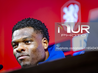 Netherlands defender Denzel Dumfries attends a press conference at the Puskas Arena for the UEFA Nations League season 2024-2025 in Budapest...