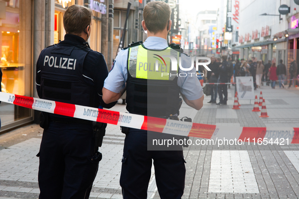 Police block the site at a shopping area after a knife attack in the city center of Cologne, Germany, on October 10, 2024. 