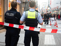 Police block the site at a shopping area after a knife attack in the city center of Cologne, Germany, on October 10, 2024. (