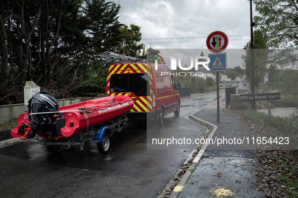 Firefighters respond to one incident after another, using a zodiac in Pommeuse, Seine-et-Marne department, east of Paris, on October 10, 202...