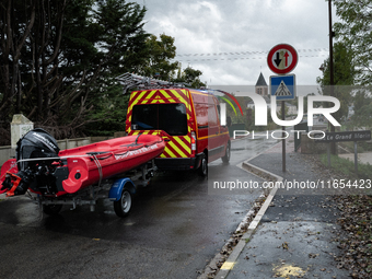 Firefighters respond to one incident after another, using a zodiac in Pommeuse, Seine-et-Marne department, east of Paris, on October 10, 202...