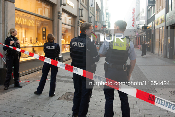 Police block the site at a shopping area after a knife attack in the city center of Cologne, Germany, on October 10, 2024. 