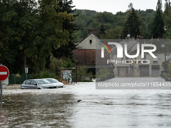 Flooded street and cars in Pommeuse, Seine-et-Marne department, east of Paris, on October 10, 2024, as the heavy rains associated with the K...