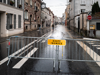 A road sign that reads ''flooded road'' is displayed on a flooded street in Coulommiers, Seine-et-Marne department, east of Paris, on Octobe...