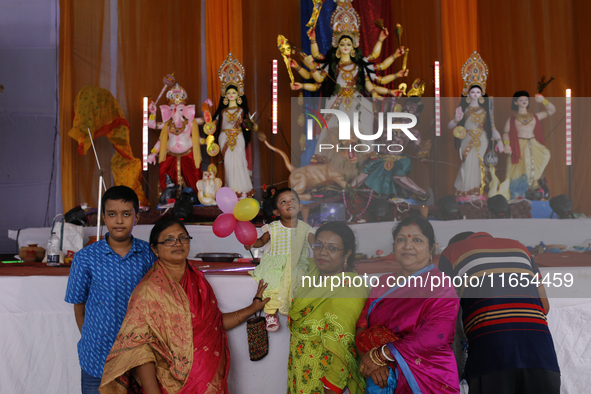 Hindu devotees visit a puja mandap during the Durga Puja festival in Dhaka, Bangladesh, on October 10, 2024. 